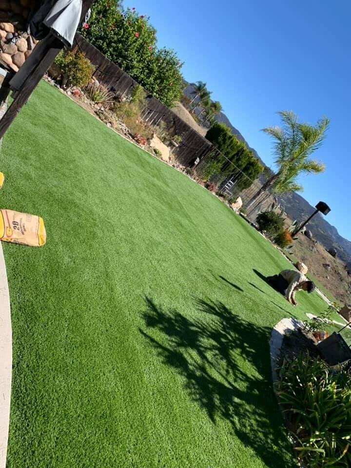 Lush green lawn installed by Rain Pro with the San Diego backcountry hills in the background
